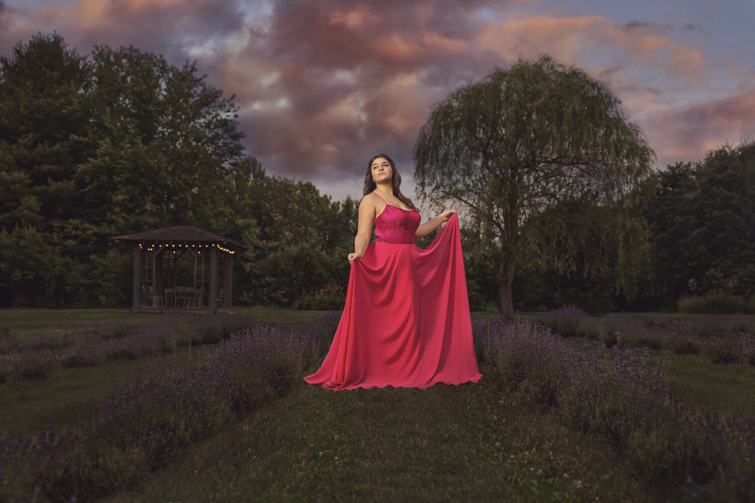 Indianapolis High School Senior Portrait wearing Pink Prom Dress standing in a lavender field